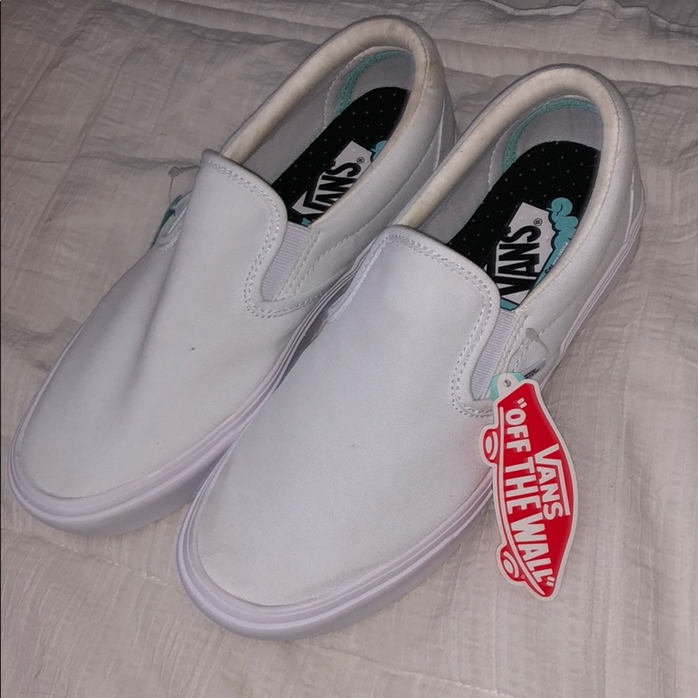 white slip on vans
